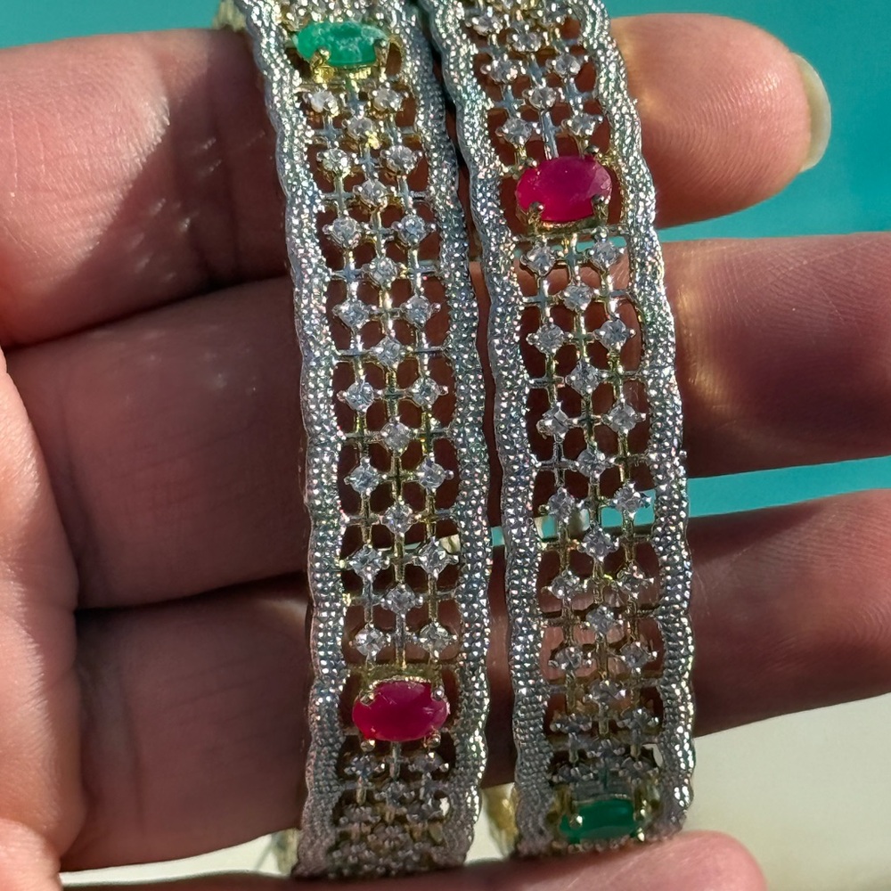 Ornate Silver and Gold Bracelets with Intricate Design